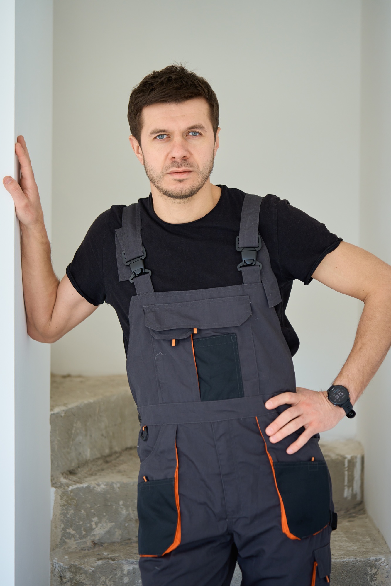 Professional construction worker in unfinished apartment